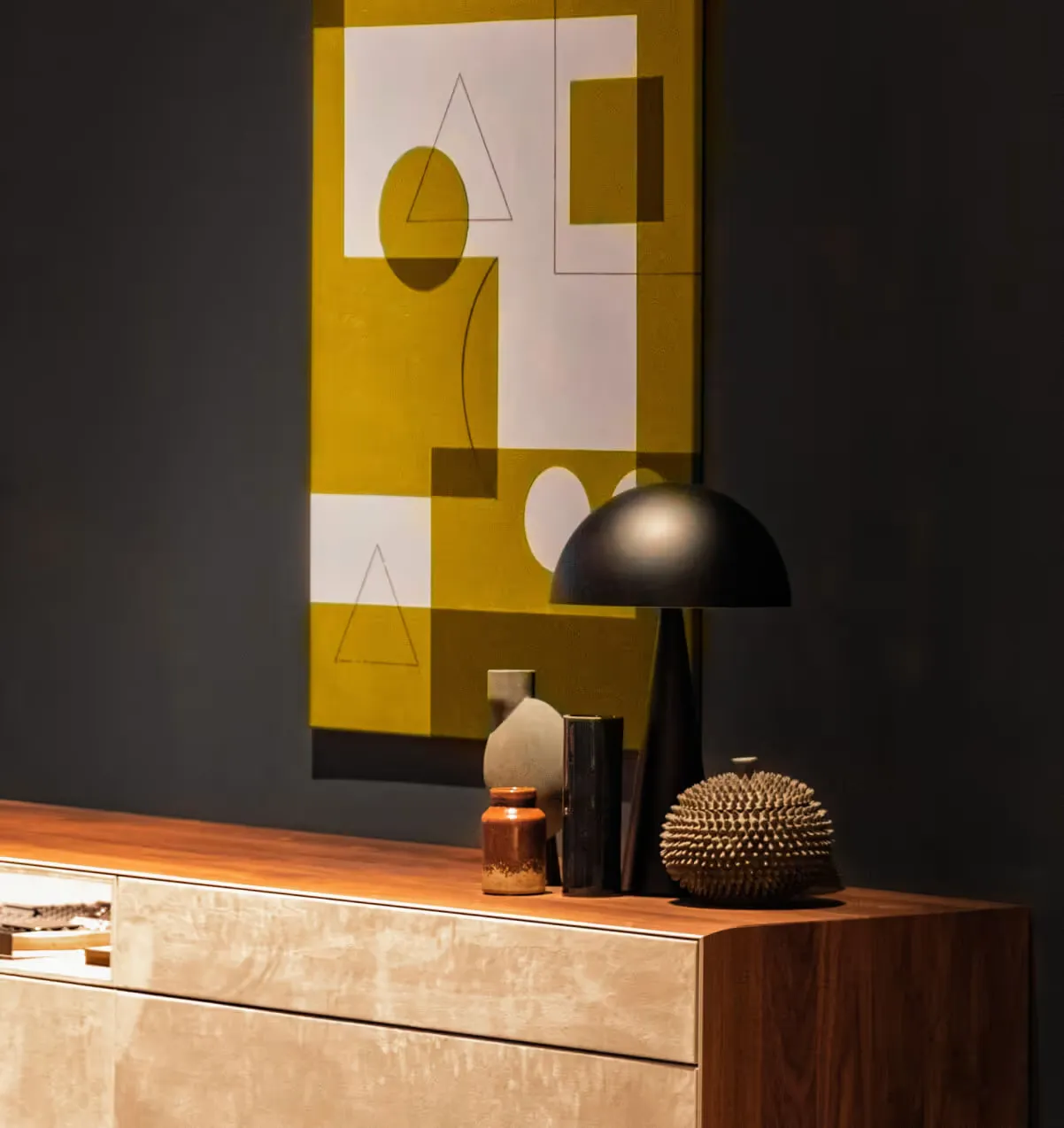 Curated accessories and original artwork styled on a console