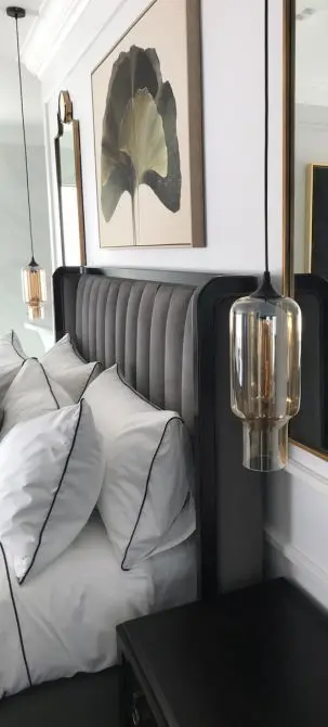 Bedroom styled with curated art and accessories