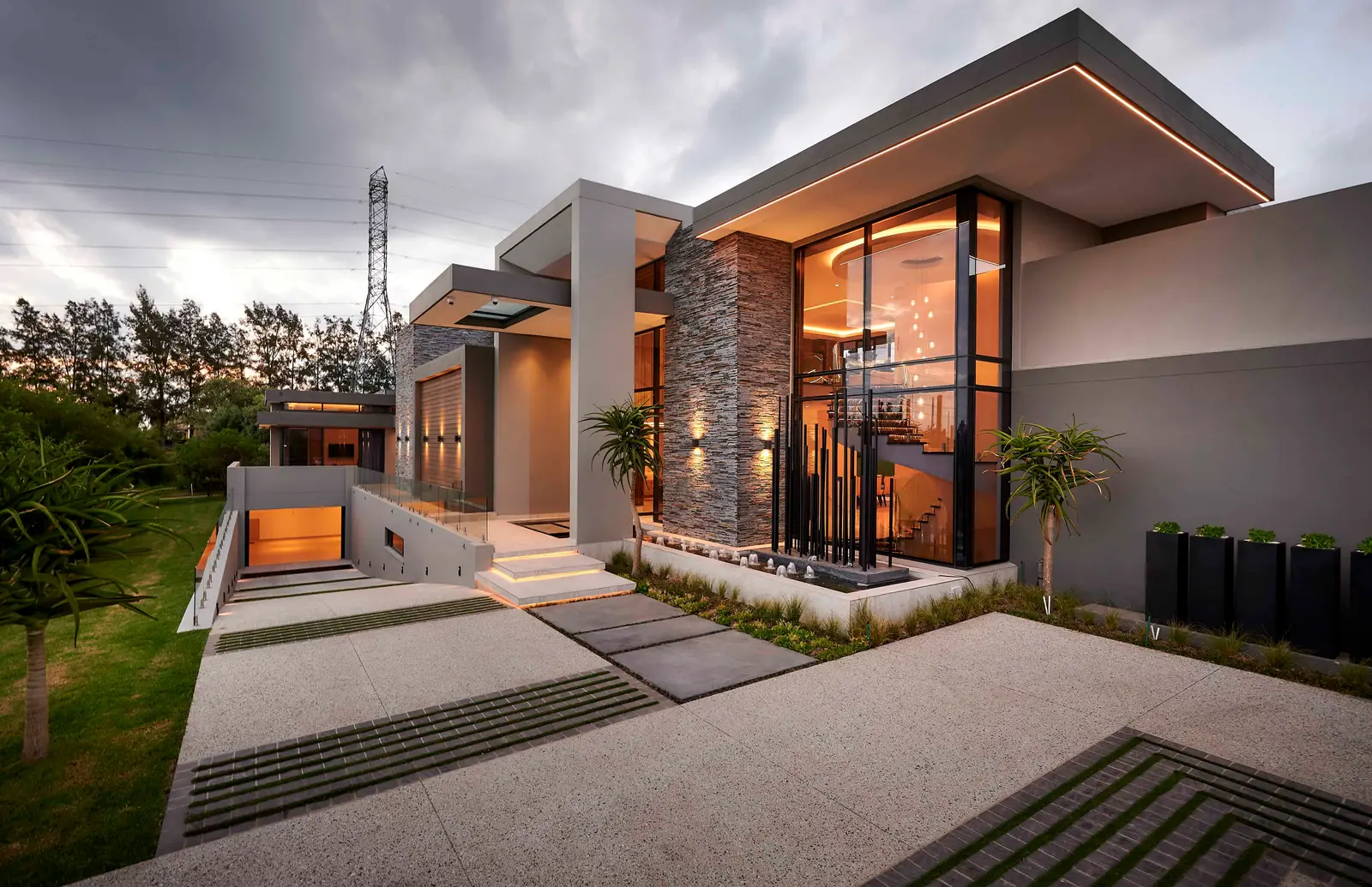 Modern home exterior featuring wooden panels and a landscaped pathway – work of Interior Designer Johannesburg.