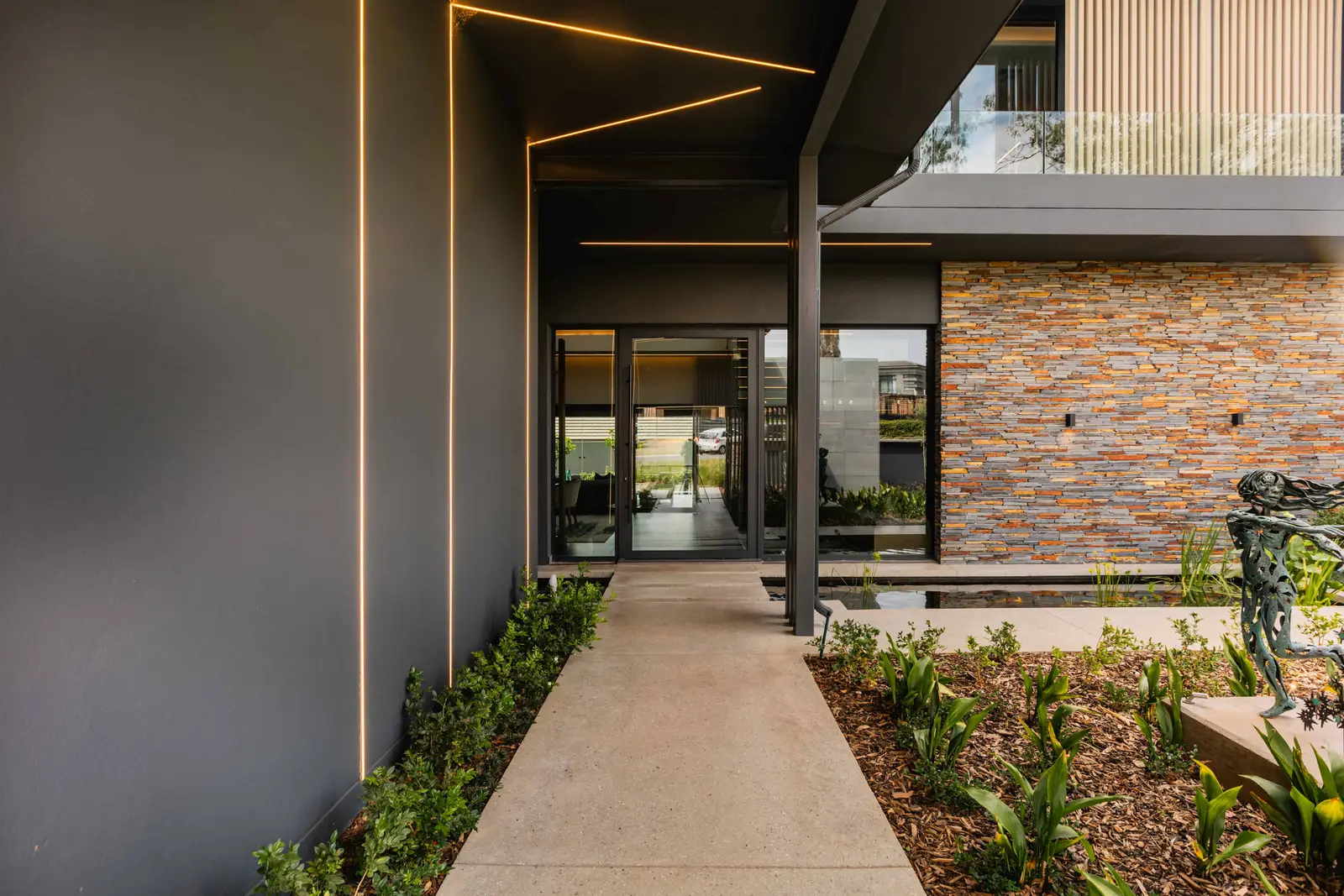 rchitectural exterior detail and stone façade of luxury Steyn City home by Renovatio Interiors Johannesburg.