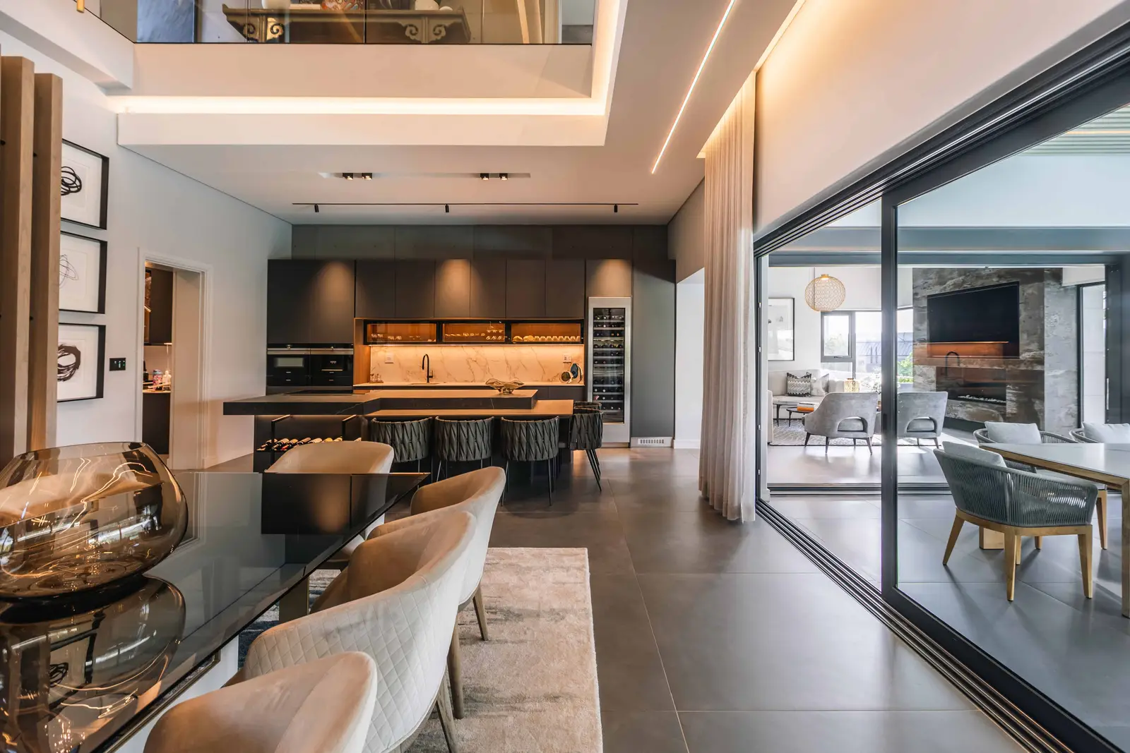 High-end kitchen and dining space with marble finishes in Steyn City home, Renovatio Interiors Johannesburg.