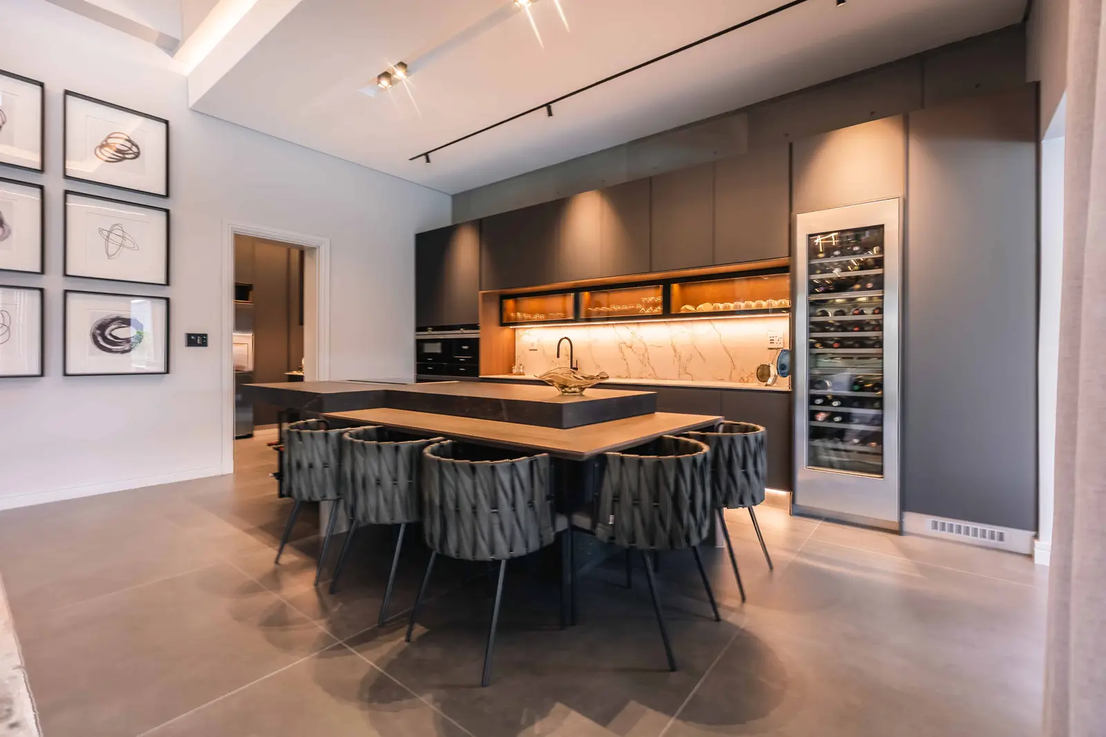 Luxury open-plan kitchen and dining area in Steyn City residence by top Johannesburg interior designer Renovatio.