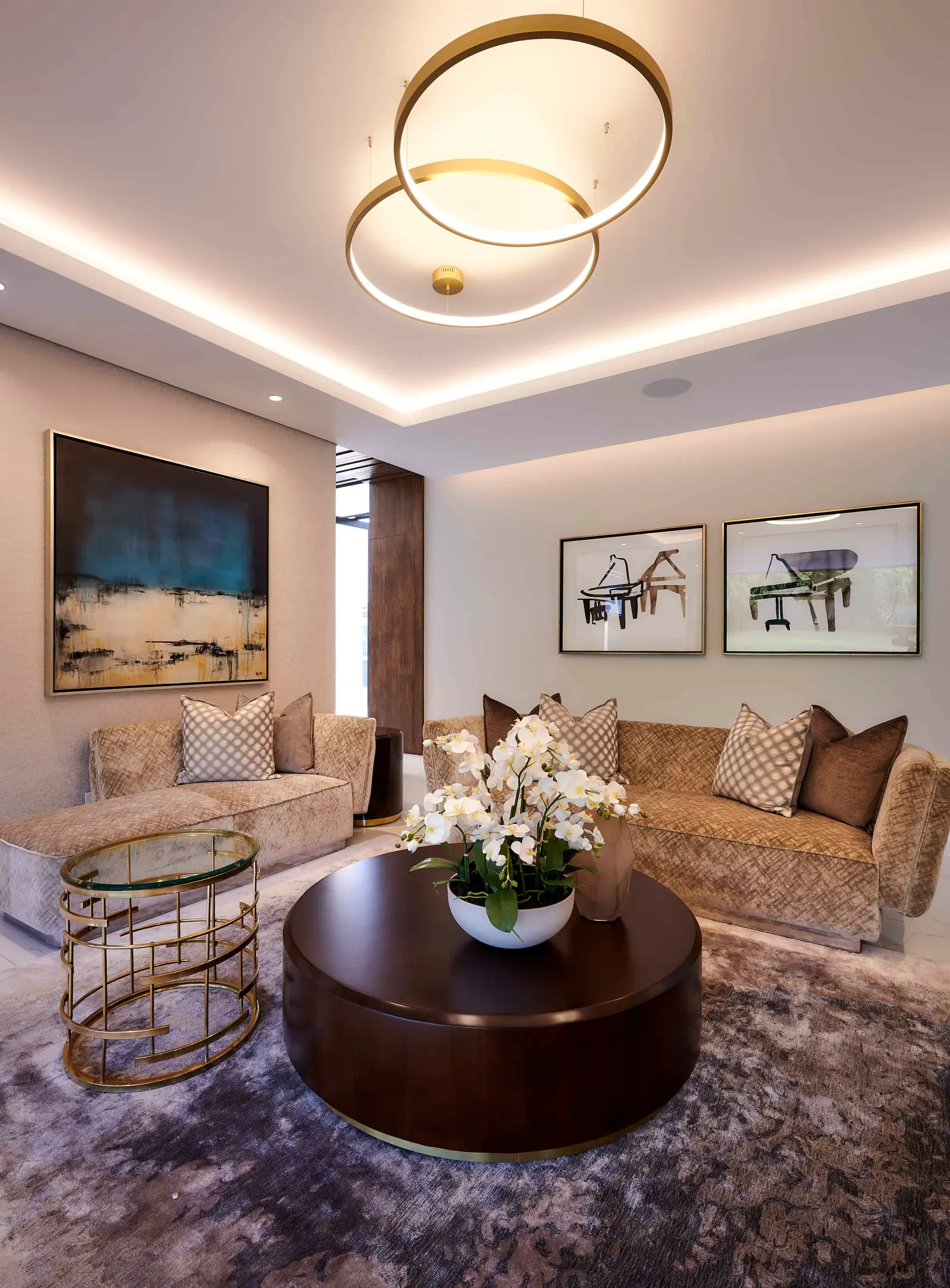 Modern open‑plan living and dining area with high ceilings designed by Interior Designer Johannesburg.