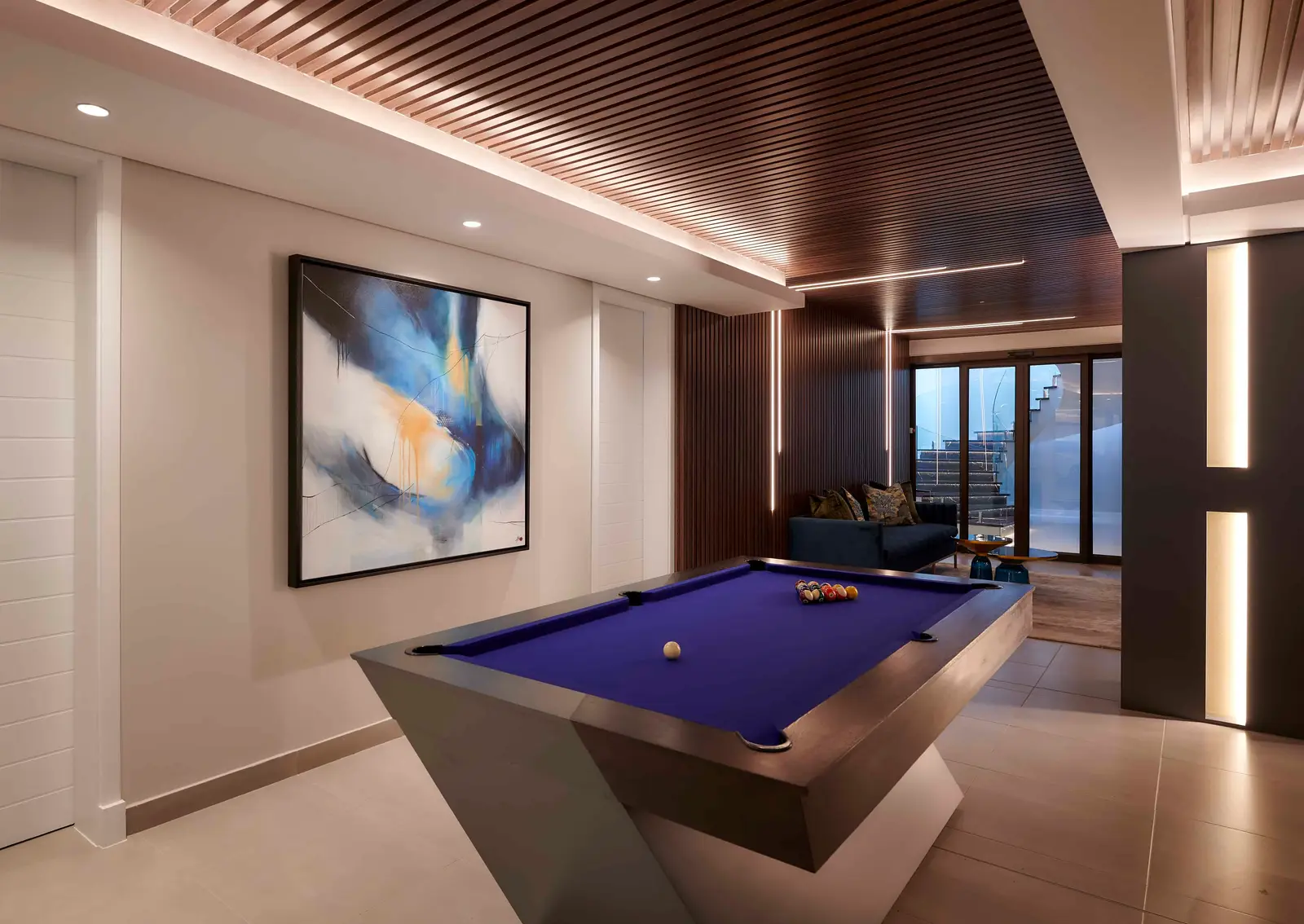 Sophisticated games room with pool table and illuminated ceiling detail by Interior Designer Johannesburg.