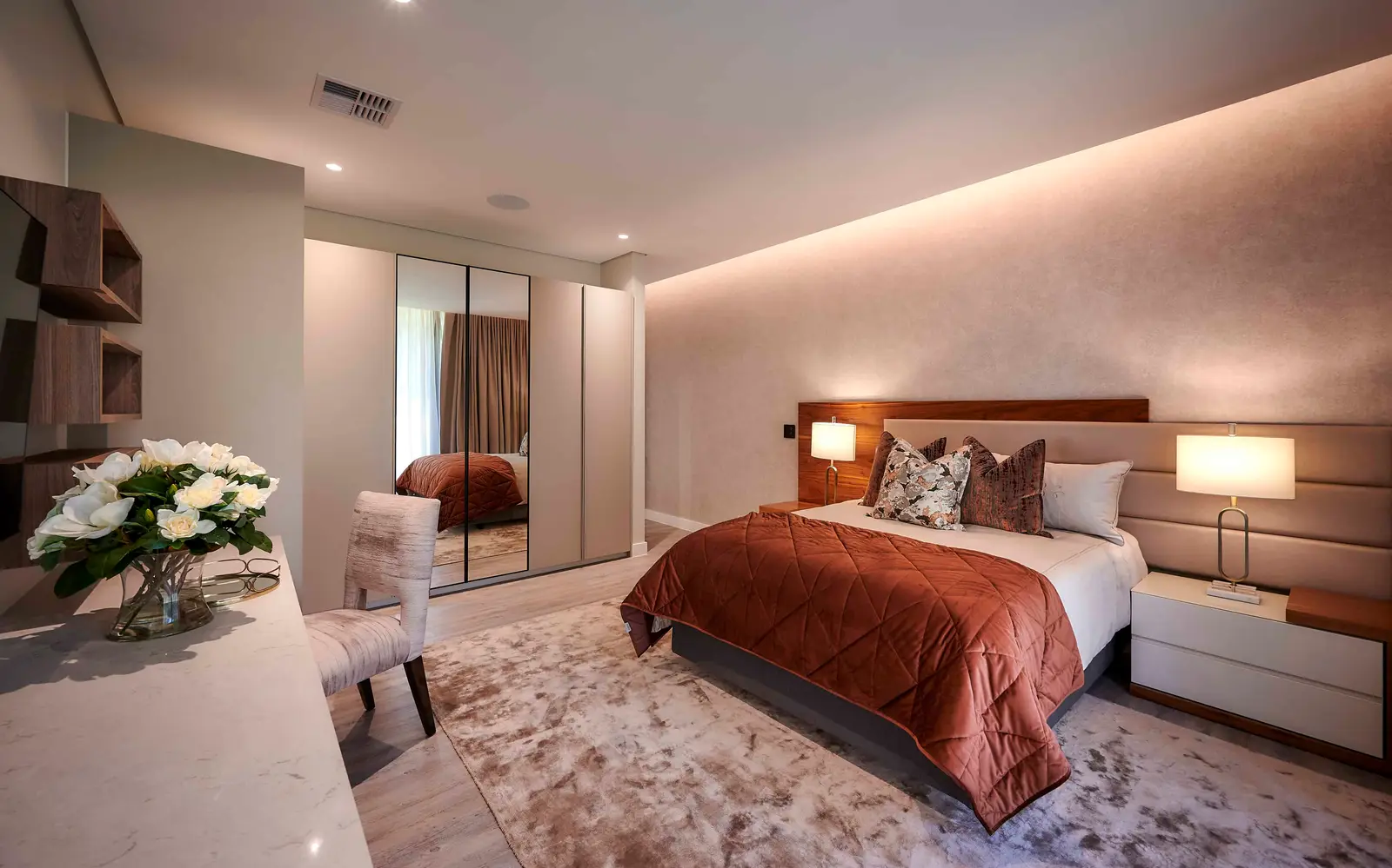 Stylish bedroom with textured accent wall and modern bed frame by Interior Designer Johannesburg.