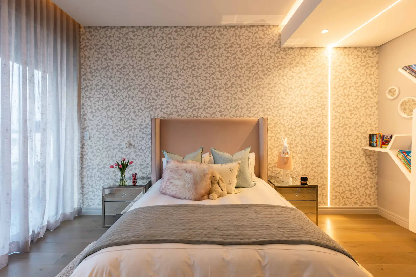 Child’s bedroom with soft pink accents and cozy layered bedding, Steyn City – Renovatio Interior Design Johannesburg.