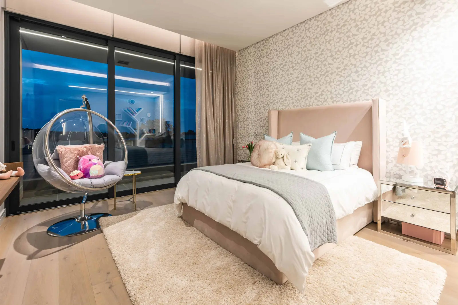 Bright child's bedroom with floor-to-ceiling windows and modern furnishings in Steyn City luxury home – Johannesburg interior designer Renovatio.