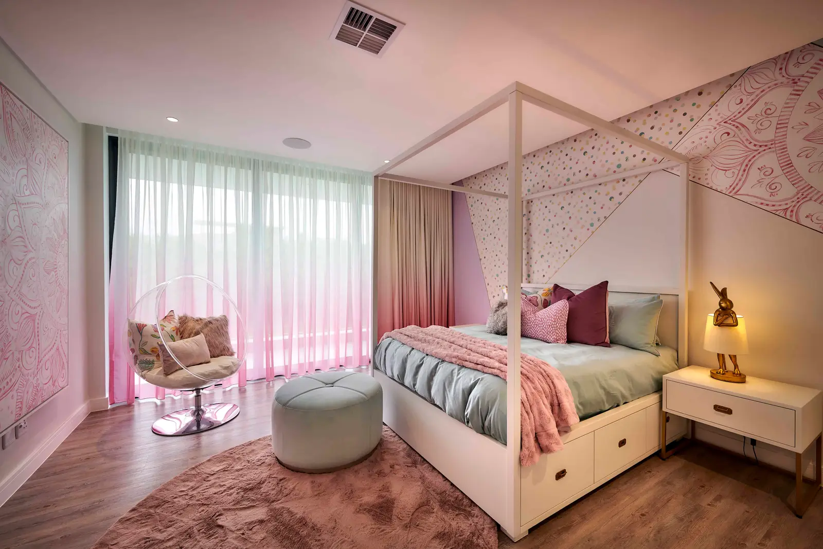 Stylish bedroom with a four‑poster bed, pastel accents and contemporary furniture designed by Interior Designer Johannesburg.