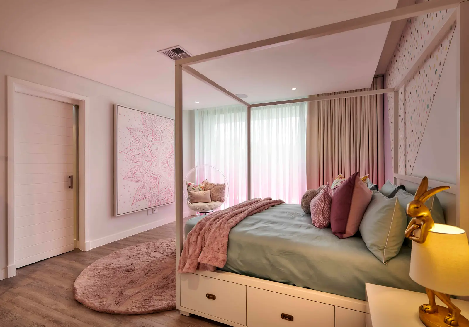 Pastel‑themed bedroom featuring a canopy bed, vibrant pillows and playful decor created by Interior Designer Johannesburg.