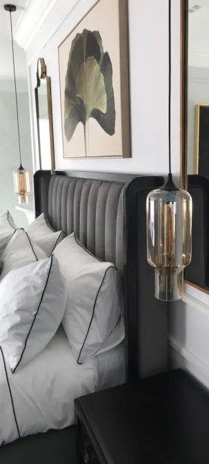 Bedroom styled with curated art and accessories